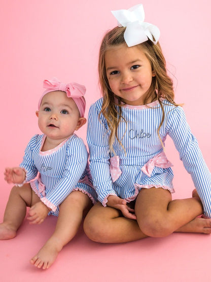 RuffleButts Periwinkle Blue Seersucker Long Sleeve One Piece Bow Peplum Rash Guard Swimsuit