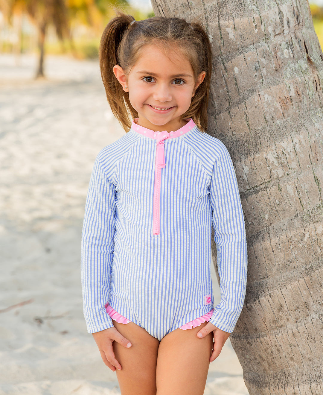 RuffleButts Seersucker Long Sleeve One Piece Zip Up Rash Guard Swimsuit